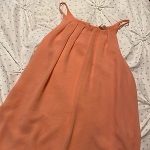 Size small, salmon colored shirt, bought from a boutique